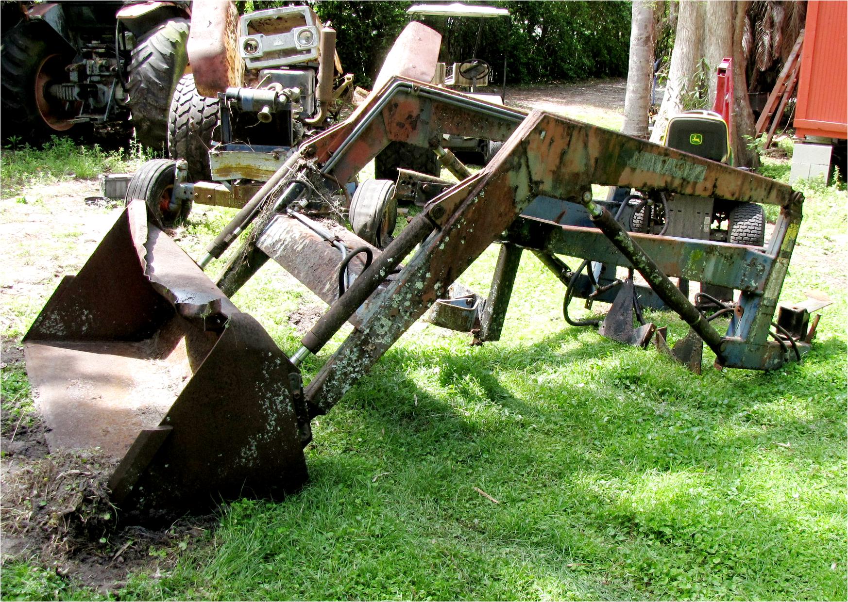 Front end loader side view for Mitsubishi MT750 tractor
