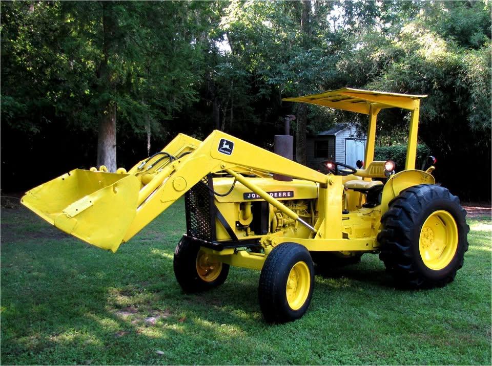 After restoration photo of John Deere 301A diesel tractor with loader