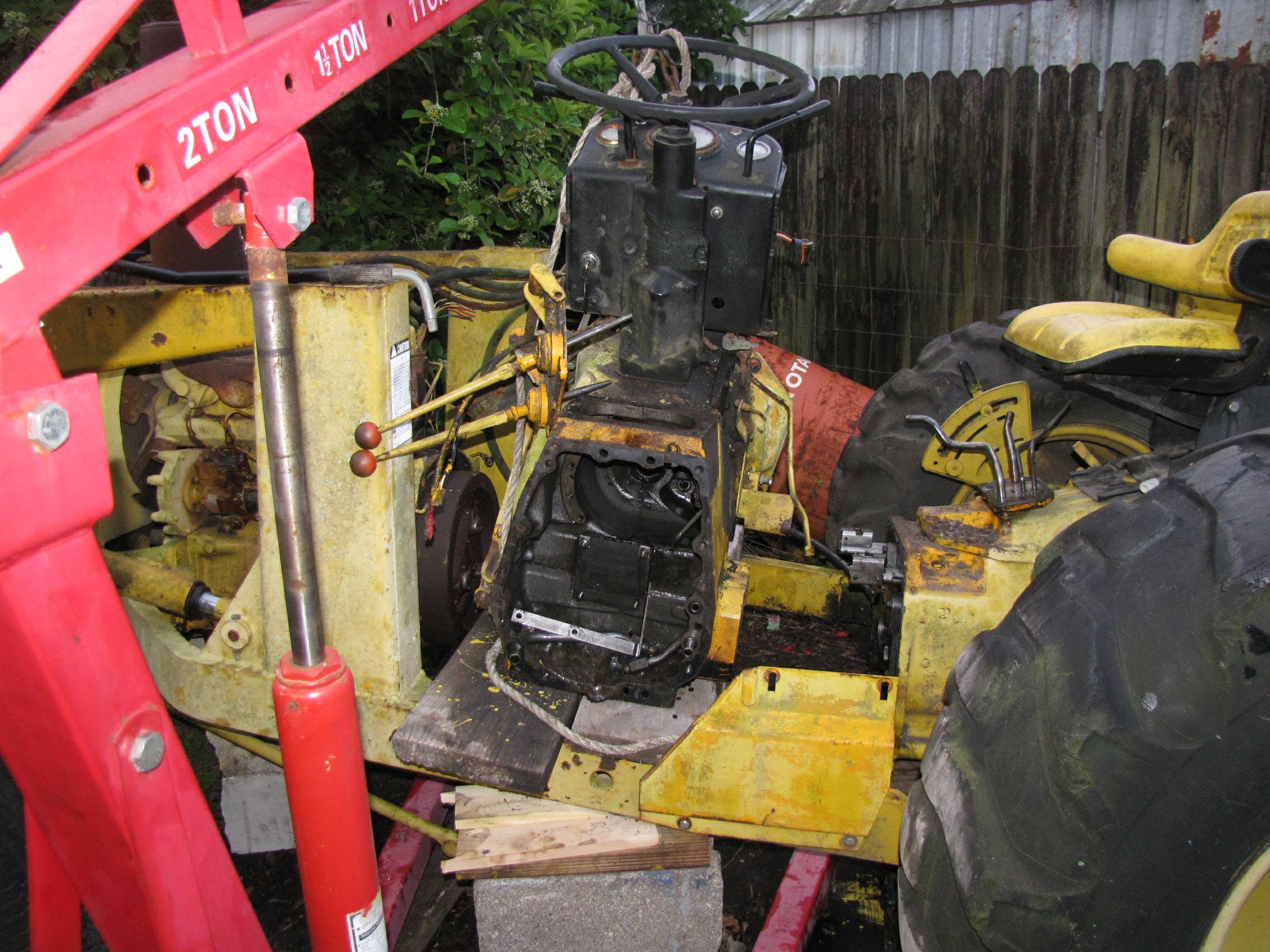 During restoration photo of John Deere 301A diesel tractor with loader